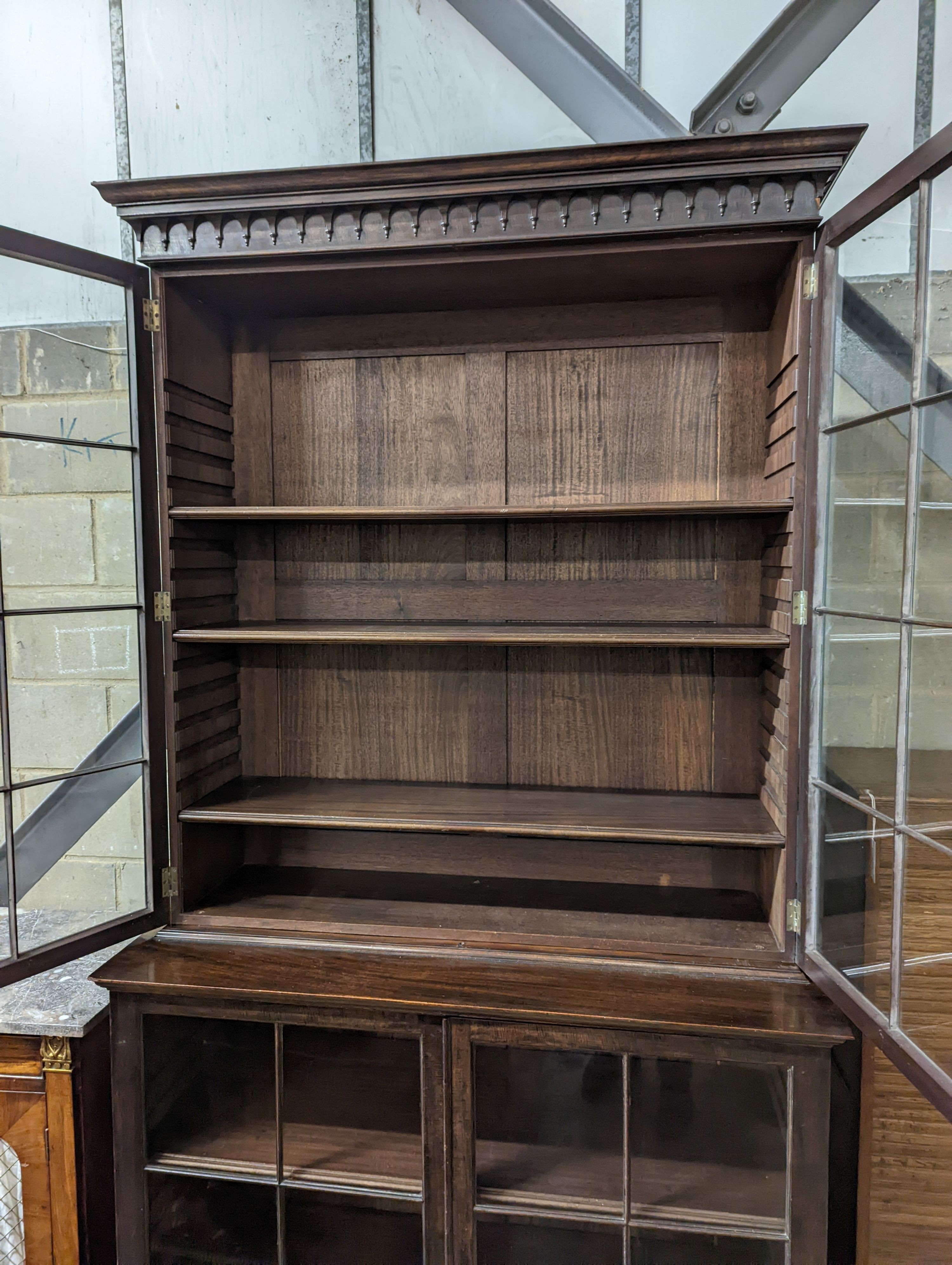 An Edwardian George III style glazed mahogany bookcase, width 113cm, depth 47cm, height 225cm